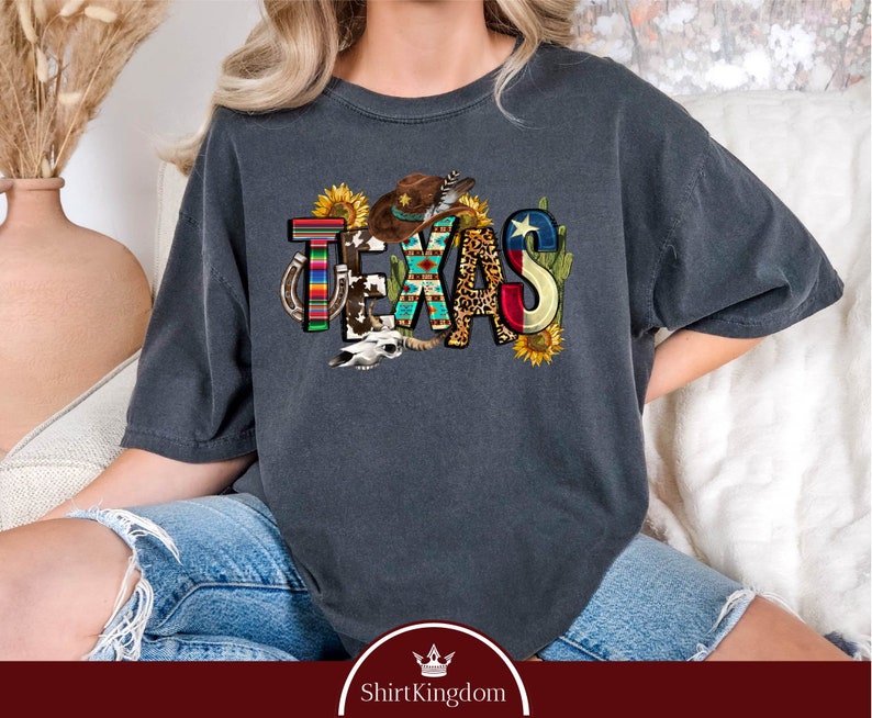 a woman sitting on a couch wearing a t - shirt that says texas