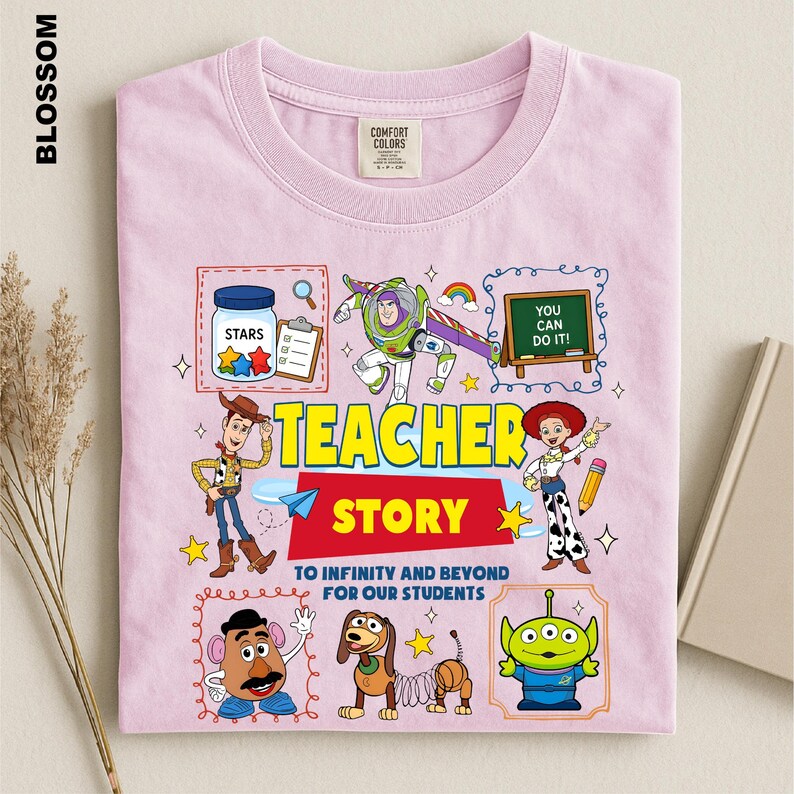 A pink t-shirt with a colorful and whimsical design featuring characters from the Toy Story movie, including Woody, Buzz Lightyear, and other beloved characters.