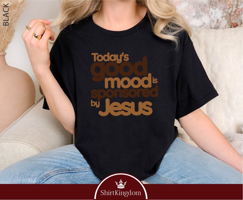 a woman sitting on a couch wearing a t - shirt that says today's