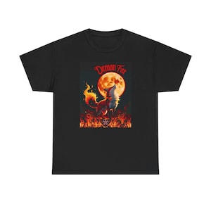 May include: Black t-shirt featuring a graphic of a fox with fiery fur howling at a large orange moon. The text "Demon Fox" is above the moon. Flames and a pentagram are at the bottom of the image.
