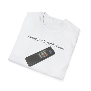May include: White t-shirt with the text "cubic punk, pubic punk" and a black remote control printed on it.