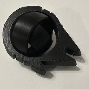 May include: A black 3D printed Star Wars X-Wing fighter model.