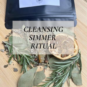 May include: A black pouch labeled "Cleansing Simmer Pack" sits above a wooden surface scattered with herbs, spices, and a dried citrus slice. The text "Cleansing Simmer Ritual" is overlaid on the image.