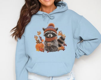 Camiseta, moletom ou blusa de moletom com capuz com estampa de guaxinim fofo para o outono, camiseta aconchegante para amantes de café, presente perfeito com estampa de folhas de abóbora.