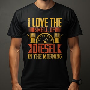May include: Black t-shirt featuring the text "I LOVE THE SMELL OF DIESEL IN THE MORNING" in yellow and orange. The design includes a gas pump graphic and a speedometer.
