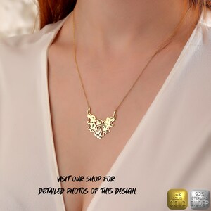 K&ouml;nnte beinhalten: Eine goldene Halskette mit einem Anh&auml;nger in Form eines stilisierten Engelsfl&uuml;gels. Der Anh&auml;nger ist aus 14 Karat Gold gefertigt und die Kette aus 925er Sterlingsilber.