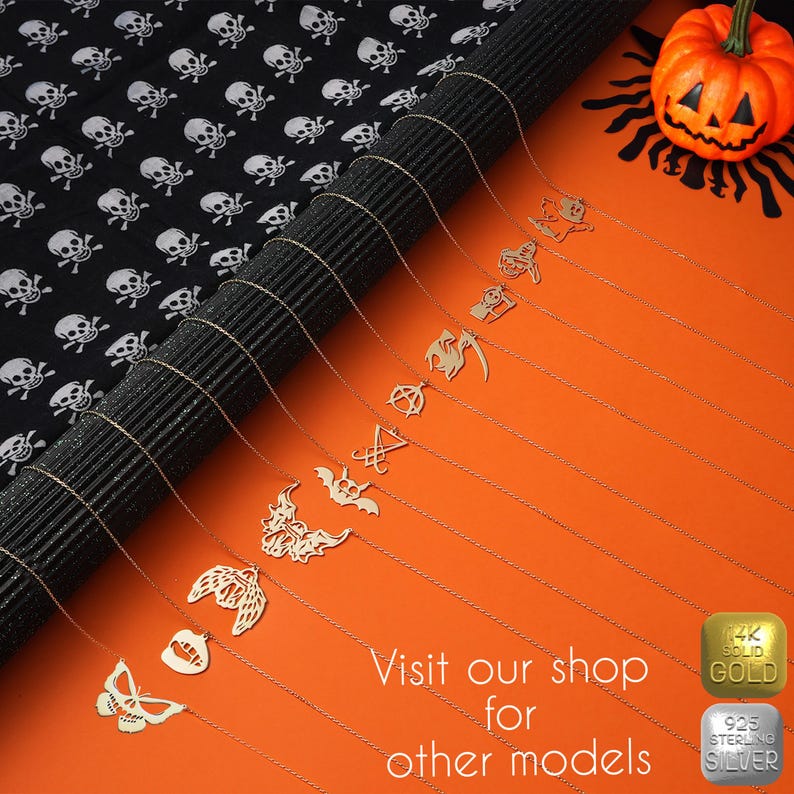 May include: A collection of gold necklaces with various Halloween-themed pendants, including a bat, a skull, a scythe, and a pentagram. The necklaces are displayed on a black and white skull patterned background. The text "Visit our shop for other models" is visible at the bottom of the image.