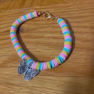 Cotton candy bracelet with butterfly charm