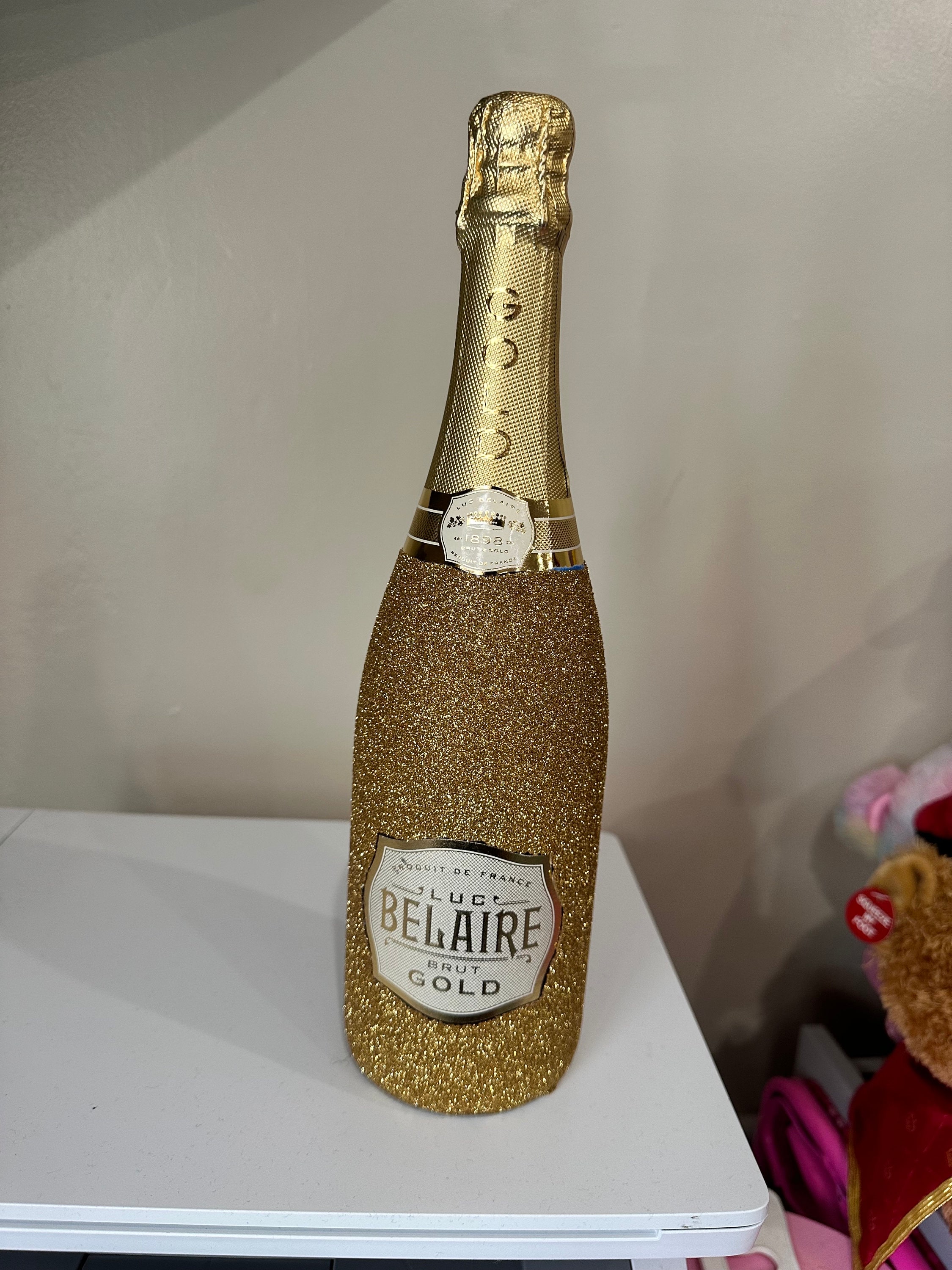 Glitter champagne bottle deals