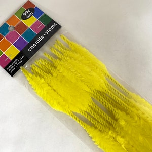 May include: A package of 12 yellow chenille stems, 18 inches long. The package says "99¢ Crafts" and "chenille stems".