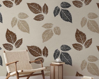 May include: A beige textured wallpaper with a repeating pattern of brown, beige, and gray leaves. A wicker chair and a small round wicker side table with a cup and saucer on top are in the foreground.