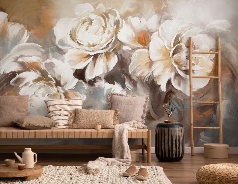 May include: A living room interior design with a wooden bench, pillows, a ladder, a side table, and a rug. The wall is decorated with a large abstract floral mural in shades of brown, white, and beige.