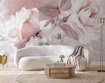 Puede incluir: Un sofá blanco con una manta de tiro se encuentra frente a una pared con un mural floral de acuarela con rosas rosas y blancas.