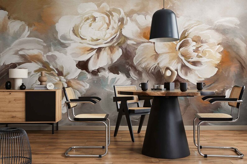May include: A dining room with a wooden table and four chairs. The wall is decorated with a large floral mural featuring white and brown flowers. A black pendant light hangs above the table.