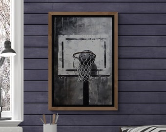 May include: A bedroom with a bed with a brown and gray blanket, black and white striped pillows, and a gray blanket. There is a wooden wall with a framed black and white print of a basketball hoop above the bed. There is a white nightstand with a stack of books and a lamp on it.