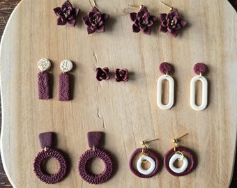 Handgemaakte bordeauxrode polymeerklei-oorbellen: bloemen en abstracte ontwerpen