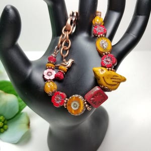 Mustard yellow and red Czech glass bird bead bracelet, mustard bird bracelet, red floral Czech bracelet, orange Czech glass beads bracelet