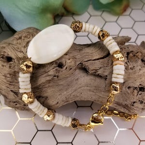White Mother of pearl shell oval bead bracelet, white shell heishi beaded bracelet, gold  plated lava beaded bracelet, stainless steel chain