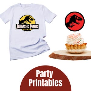 May include: White t-shirt with a "Jurassic Park" logo featuring a black dinosaur silhouette on a yellow circle. A cupcake with white frosting and sprinkles sits on a wooden slice, topped with a dinosaur-themed topper. The image also includes a "Party Printables" graphic.