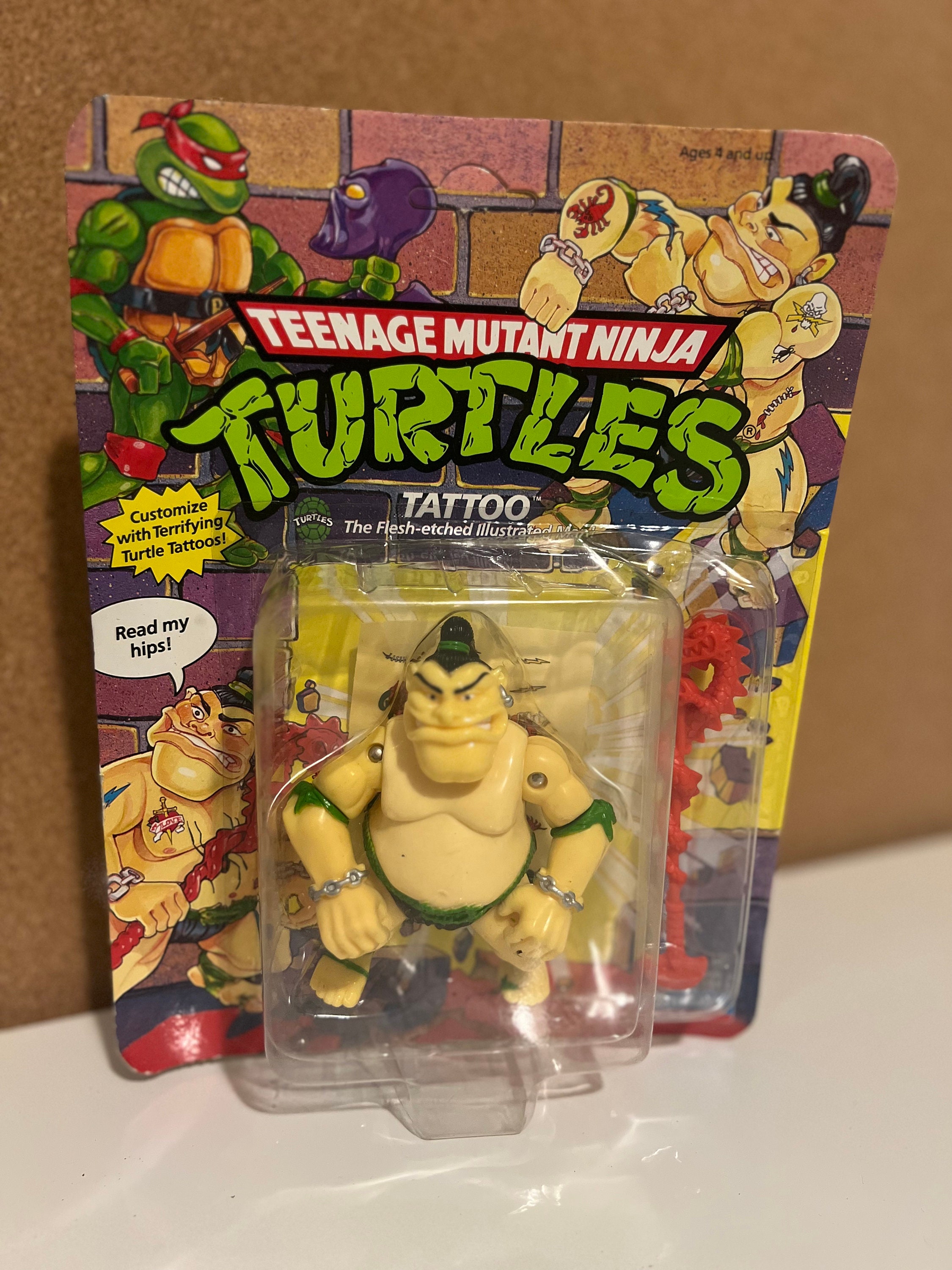 Right forearm tattoo of Leonardo, the ninja turtle, on