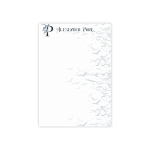 May include: White notepad with a decorative border of flying bats. The upper left corner features a stylized letter "P" with bat wings, followed by the text "Alexander Pope" in elegant script. The bats are in shades of gray.