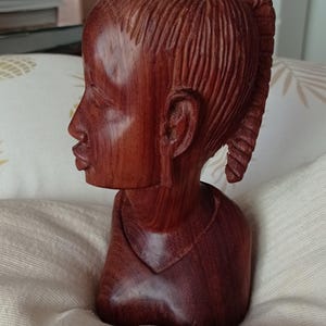 Female head in exotic wood
