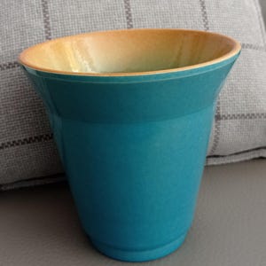 Turquoise vase with yellow-brown interior