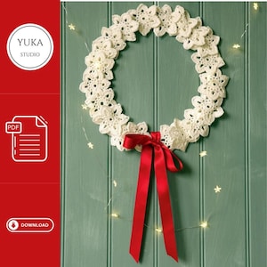 May include: A white crocheted wreath with a red ribbon bow, hanging on a green wooden door with white fairy lights.