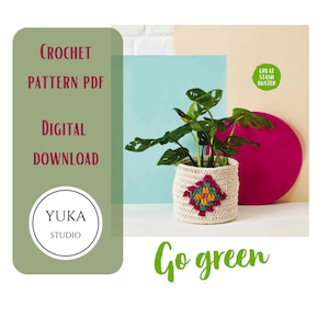 May include: A crocheted plant pot with a colorful geometric design holds a green plant. The image includes text that reads "Crochet Pattern PDF Digital Download" and "Go green". The Yuka Studio logo is also visible.
