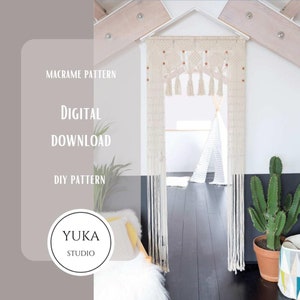 May include: A digital download pattern for a macrame wall hanging. The pattern is called "DIY Pattern" and is from "Yuka Studio". The image shows a white macrame wall hanging with wooden beads, hanging in a room with a white wall and a black floor.