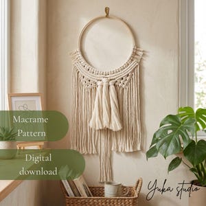 May include: A cream-colored macrame wall hanging featuring a circular wooden hoop, intricate knotted patterns, and long fringe tassels. The text "Macrame Pattern Digital download" and "yuka studio" is visible on the image overlay.