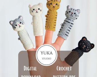 May include: Five handmade crochet finger puppets shaped like cats in various colors: gray, white, yellow, and black. Each puppet has a cat face with embroidered details. The image includes the text "Yuka Studio" and "Digital Download Crochet Pattern PDF."