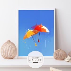 May include: A digital painting of two colorful umbrellas floating in a blue sky. The umbrellas are yellow and red, and they are both open. The sky is a light blue, and there are some white clouds in the background. The text "GALLERY GALORE" is at the bottom of the image.