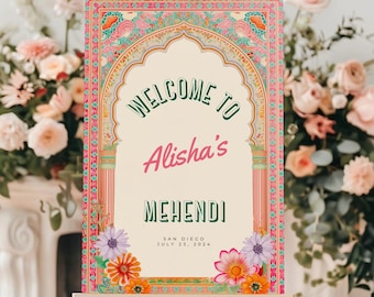 May include: A colorful welcome sign with an ornate archway design, featuring the text "Welcome to Alisha's Mehndi, San Diego, July 23, 2024".