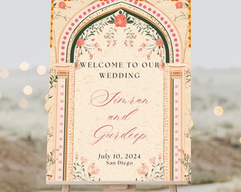 May include: A wedding welcome sign with an ornate archway design in shades of orange, pink, and green. The text reads "Welcome to our wedding, Simran and Gurdeep, July 10, 2024, San Diego."
