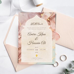 May include: A wedding invitation with a pink and gold marble design. The invitation features an Arabic inscription, the names "Amira Khan & Hussain Ali", and the date "July 22, 2022".