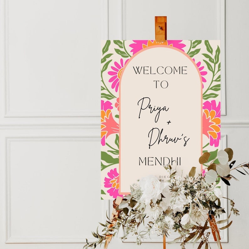 Colourful mehendi welcome sign in pink and green