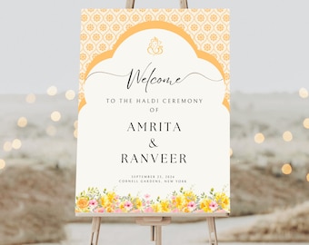 May include: A welcome sign for a Haldi ceremony with a yellow and orange floral design. The sign reads "Welcome to the Haldi Ceremony of Amrita & Ranveer September 23, 2024 Cornell Gardens, New York."