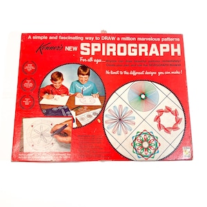 May include: A vintage Spirograph set in a red box. The box features the text "Kenner's NEW SPIROGRAPH" and illustrations of children using the toy. The box also shows examples of the patterns that can be created with the Spirograph.
