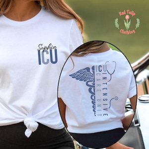 May include: A white t-shirt featuring a blue graphic on the chest with the name Sophia and the letters ICU. The back of the shirt displays a blue caduceus symbol, a stethoscope, and the vertical text Intensive Care Unit in blue lettering.