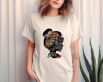 May include: A white t-shirt with a black silhouette of a woman standing in a library. The text on the shirt reads "& Into the library she goes to lose her MIND and Find her SOUL."