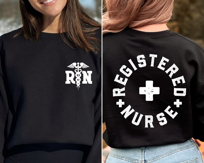 May include: Black sweatshirt with a white graphic of a medical caduceus and the letters "RN" on the front. The back of the sweatshirt has a white circle with the text "REGISTERED NURSE" and a white plus sign in the center.