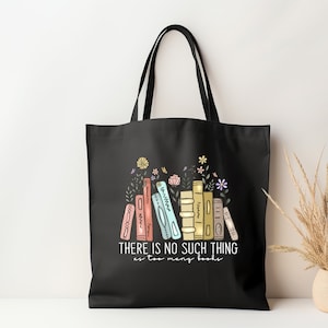May include: Black tote bag with a graphic of a stack of colorful books with flowers on top. The text "THERE IS NO SUCH THING as too many books" is printed below the books.