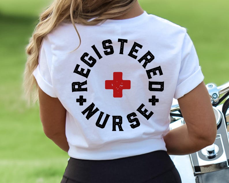 May include: White t-shirt with a black circle graphic that says "Registered Nurse" with a red plus sign in the center.
