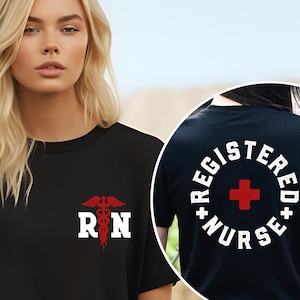 May include: Black t-shirt with a white "RN" and red medical symbol on the front. The back of the shirt has a white circle with the text "REGISTERED NURSE" and a red cross in the center.