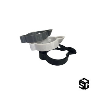May include: Three 3D printed plastic rings in black, white, and gray. The rings are stacked on top of each other.