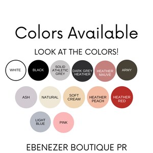 May include: A chart showing the different colors available for a product. The colors include white, black, solid athletic grey, dark grey heather, heather mauve, army, ash, natural, soft cream, heather peach, heather red, light blue, and pink. The text "LOOK AT THE COLORS!" and "EBENEZER BOUTIQUE PR" are also included.