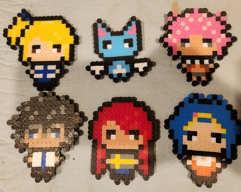 May include: Six colorful pixel art characters from the anime Fairy Tail. The characters are Lucy Heartfilia, Happy, Erza Scarlet, Gray Fullbuster, Natsu Dragneel, and Juvia Lockser. Each character is made of small plastic beads.