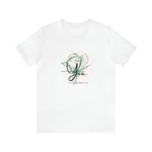 May include: White t-shirt with a green floral design and the text "I choose you over methadone".