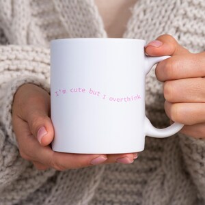 A funny and cute mug that says &quot;I&#39;m cute but I overthink&quot; perfect for those who charm with their wit and embrace their adorable complexity!